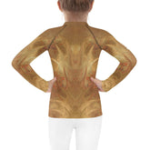 Child wearing CB6-35 rash guard enjoying beach play